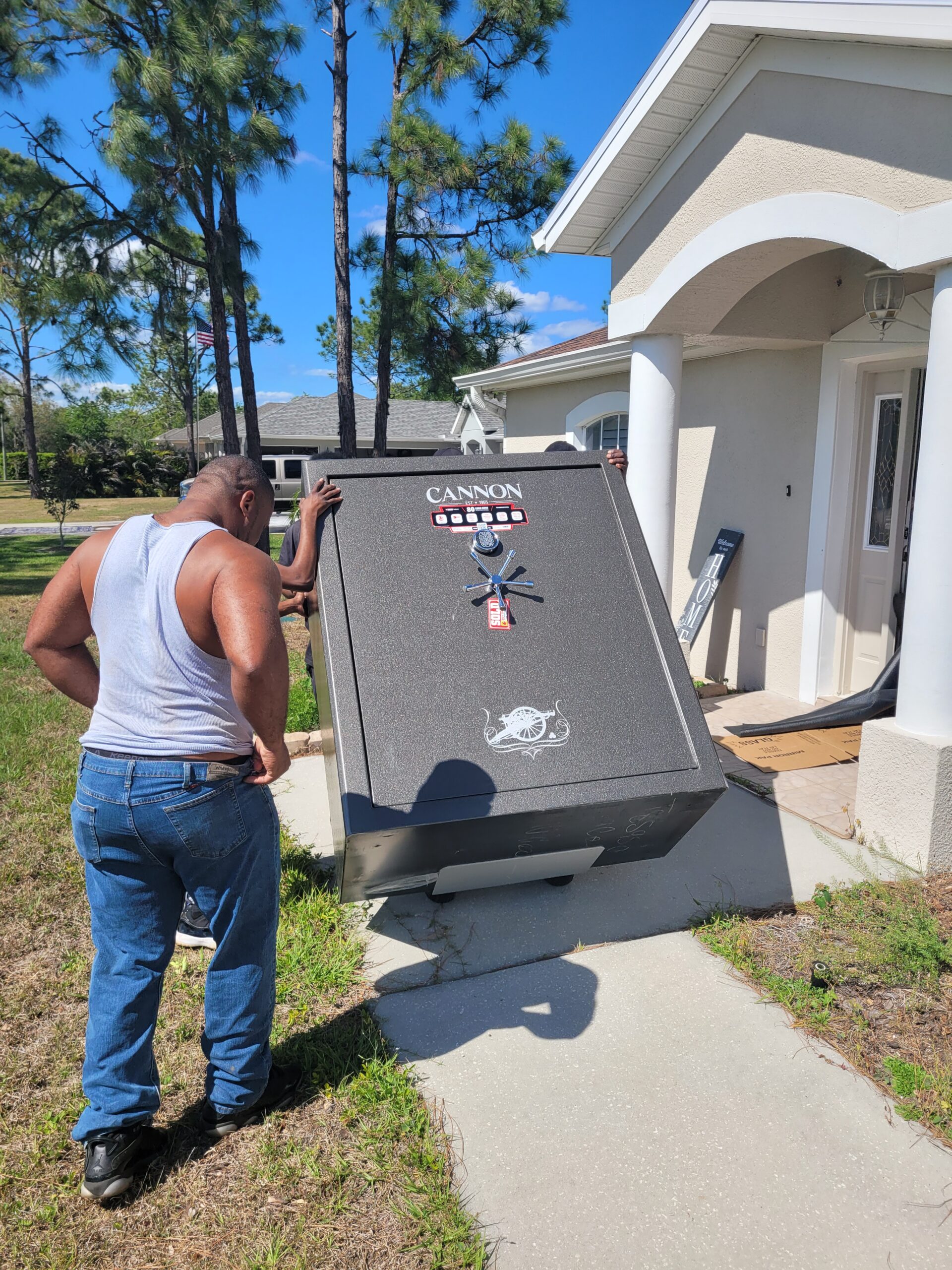 Big Man Movers crew handling a heavy safe with specialized equipment